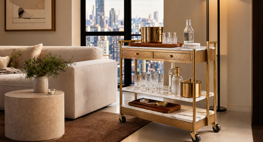 A compact apartment lounge with the TATPUB mobile hosting system, marble coasters, teak tray, and clear walking space.