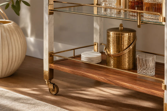 Close view of a high-end marble and hammered brass hosting system with refined materials and styling.