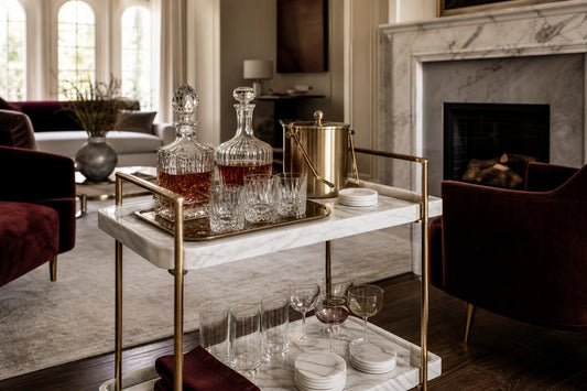 A luxury marble and brass hosting system styled in a high-end living room for a buyer guide.