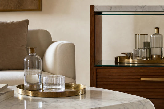 Marble and brass living room material composition with TATPUB hosting system details.