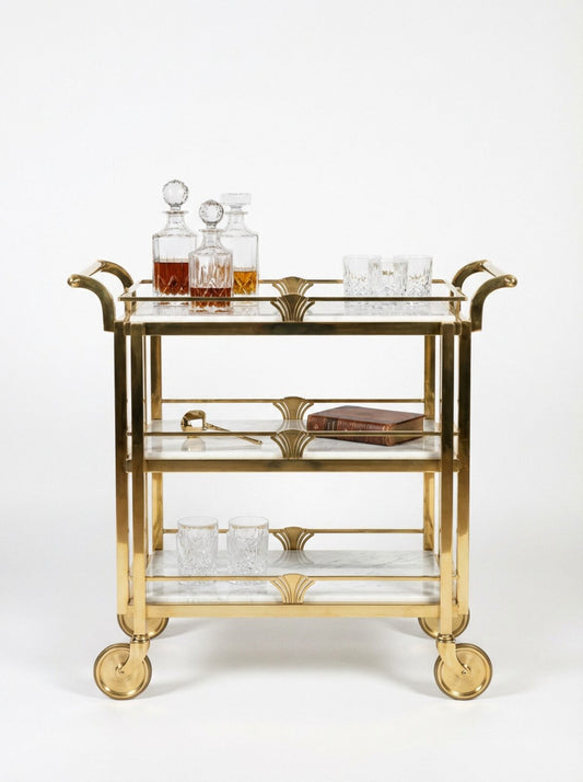 TATPUB Hosting System Edition 01 with marble top, hammered brass frame, glass shelf, teak shelf, and locking caster wheels