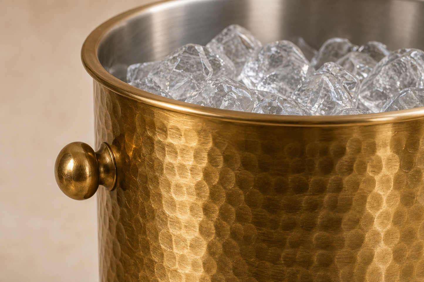 Close detail of hammered brass texture and stainless interior