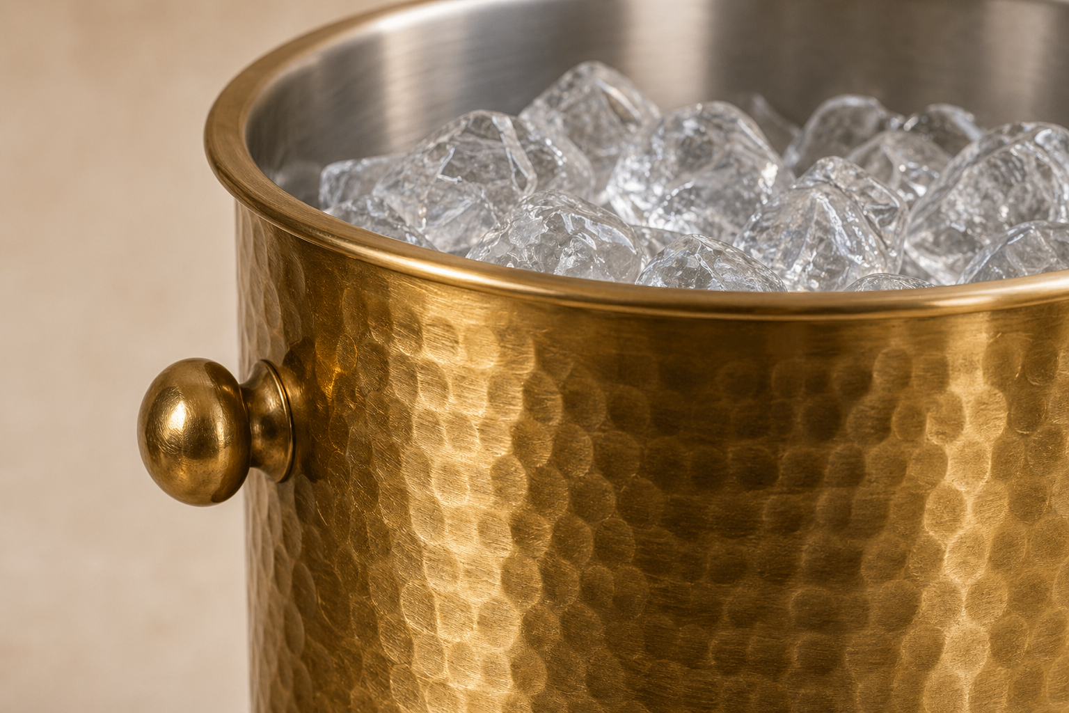 Close detail of hammered brass texture and stainless interior