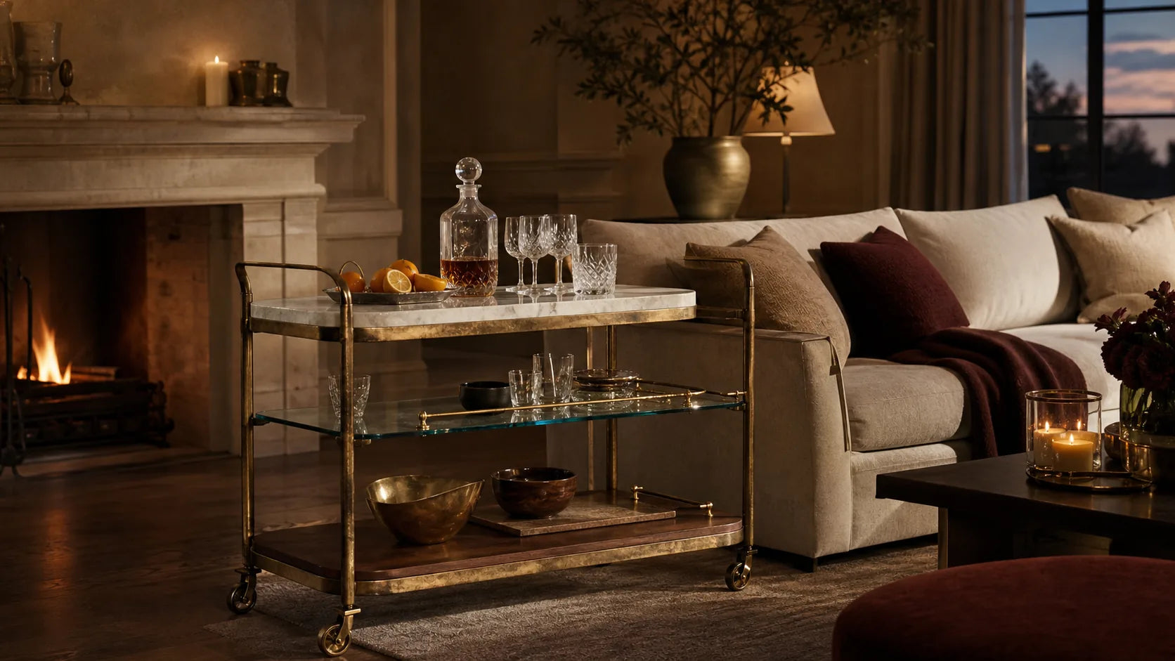 TATPUB Hosting System styled in a warm living room with marble, hammered brass, glass, and teak details.